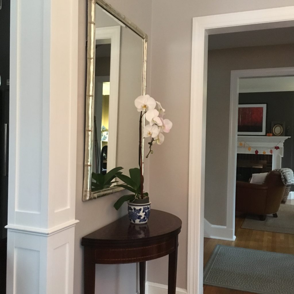 After: arches looking from dining room through foyer into living room