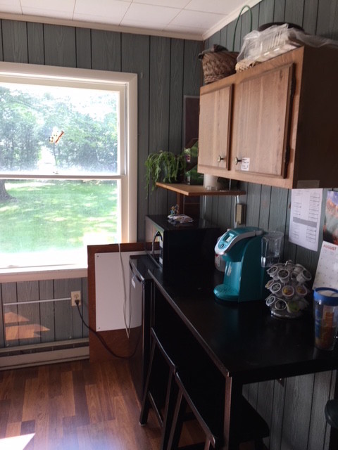 BEFORE- overhead cabinets made the room feel even more narrow